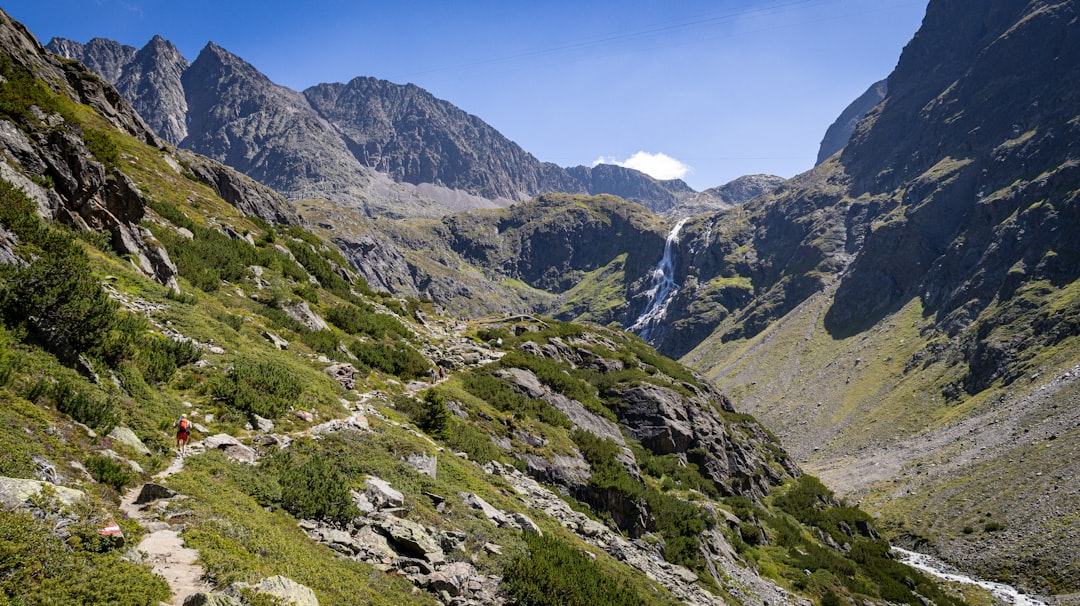 Small group hiking on a mountain trail with alpine scenery in the Cascade Range